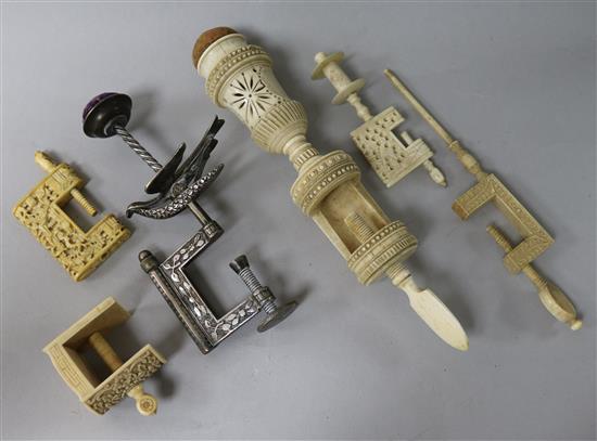 A 19th century steel sewing clamp in the shape of a bird, another carved ivory clamp with pin cushion top and 4 smaller clamps